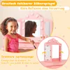 A young girl is shown using a pink play vanity set with lights and mirrors. Produktbild-Vorschau
