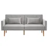 A front view of a gray velvet sofa with two pillows and wooden legs, set against a white background. Voir les images du produit