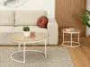 A living room scene with a couch, coffee tables, and a rug. Podgląd zdjęcia produktu