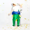 A person wearing an inflatable dinosaur costume is dancing and throwing confetti. Náhled obrázku produktu
