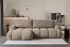 A modern living room setting with a sectional sofa as the main focus. Voir les images du produit