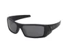 A pair of black Oakley Gascan sunglasses with dark gray lenses, shown from a front-side angle against a white background. Náhled obrázku produktu