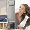 A split image showing a living room scene with a heater and a woman drying her hair. Anteprima dell’immagine prodotto