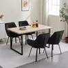A dining set with four black chairs and a light wood table. Voir les images du produit