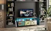 A living room scene featuring a TV stand with a television and various decorative items. Podgląd zdjęcia produktu
