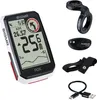 A collection of bicycle computer accessories, including the main unit, a handlebar mount, a heart rate monitor, and a charging cable. Produktbild-Vorschau