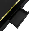 A close-up view of a black table with a gold accent and an open drawer. Voir les images du produit