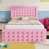 A pink bed with a playful, Lego-inspired design, set in a child's bedroom with colorful accents. Anteprima dell’immagine prodotto