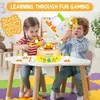 Two children playing with a duck-themed catching game at a table. Náhľad obrázku produktu