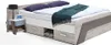 A modern bed with a nightstand and lamp. Produktbild-Vorschau