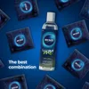 A bottle of lubricant and several condom wrappers are arranged on a blue background with text. Náhľad obrázku produktu