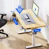 A modern adjustable height desk with a computer setup in a home office. Podgląd zdjęcia produktu