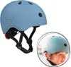 A blue helmet is shown next to a close-up of a child wearing a similar helmet. Podgląd zdjęcia produktu