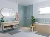 A modern bathroom with a vanity, bathtub, and shower. Voir les images du produit