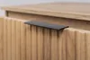 A close-up shot of a wooden cabinet drawer with a black handle. Produktbild-Vorschau