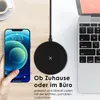 A smartphone is being held by a hand, next to a wireless charger and a laptop. Produktbild-Vorschau