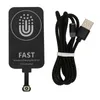 A black wireless charging receiver and a black USB cable are shown against a white background. Anteprima dell’immagine prodotto