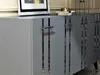 A close-up view of a modern gray sideboard with silver accents and handles. Anteprima dell’immagine prodotto