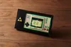 A Nintendo Game & Watch console with a Legend of Zelda theme is displayed on a wooden surface. Produktbild-Vorschau