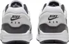The rear view of a pair of Nike Air Max 1 Essential sneakers. Produktbild-Vorschau