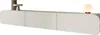 A modern, minimalist TV lowboard with rounded edges, displayed on a white background. Decorative objects, including a cylindrical vase and a small pedestal, are placed on the top surface, along with a globe-shaped lamp. Produktbild-Vorschau