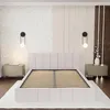 A bedroom scene with a bed and nightstands. Produktbild-Vorschau
