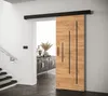 A modern interior with a sliding door, stairs, and a console table.