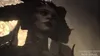 A close-up of a demonic female character with horns and glowing eyes, likely from a video game. Produktbild-Vorschau