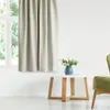 A room interior with a window, curtains, a small table with a vase of flowers, and a chair. Podgląd zdjęcia produktu