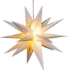A white, star-shaped lantern with small cut-out stars, illuminated from within. Produktbild-Vorschau