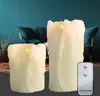 Two LED candles with a remote control in a living room setting. Produktbild-Vorschau