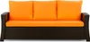 A front view of a brown rattan sofa with orange cushions.