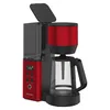 A red and black coffee maker is shown against a white background. Náhled obrázku produktu
