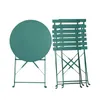 A round table and a folded chair set. Produktbild-Vorschau