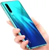 A hand holding a transparent phone case over a Huawei P30 phone. Produktbild-Vorschau