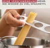 A person is using a spaghetti measuring tool to portion spaghetti over a pot of water. Produktbild-Vorschau