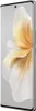 A side view of a silver smartphone with a decorative floral pattern on the screen. Voir les images du produit