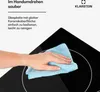 A hand is shown wiping a black glass ceramic stovetop with a blue microfiber cloth. Produktbild-Vorschau