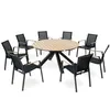 A round wooden table with eight black chairs arranged around it, set against a white background. Produktbild-Vorschau