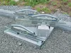 Three concrete slab lifters are placed on a construction site with gravel and concrete blocks. Podgląd zdjęcia produktu