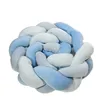 A braided pillow or bed bumper in shades of blue and light blue, shown in isolation against a white background. Produktbild-Vorschau