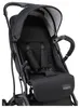 Close-up view of a black stroller seat with safety harness. Voir les images du produit