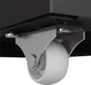 Close-up view of a caster wheel attached to the underside of a black object. Podgląd zdjęcia produktu