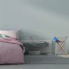 A bedroom scene with a bed, nightstand, and laundry basket. Náhled obrázku produktu