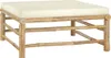 A square bamboo ottoman with a cream-colored cushion. Produktbild-Vorschau