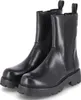 A pair of black leather Chelsea boots with thick soles, shown from the front. Anteprima dell’immagine prodotto