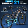 A black and orange electric mountain bike with marketing text and diagrams highlighting its features. Produktbild-Vorschau