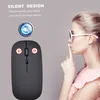 A woman is shown making a shushing gesture next to a silent computer mouse, with text highlighting its silent design. Produktbild-Vorschau