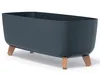 A dark gray planter with wooden legs on a white background. Produktbild-Vorschau