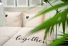 A bed with pillows and a duvet cover, decorated with hearts and the word "together". Produktbild-Vorschau